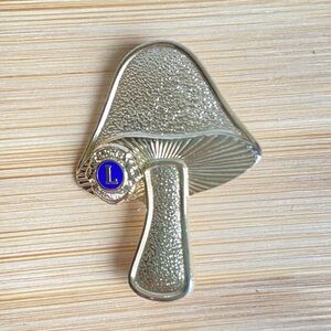 Lion’s Club International mushroom pin in goldtone with blue medallion VINTAGE